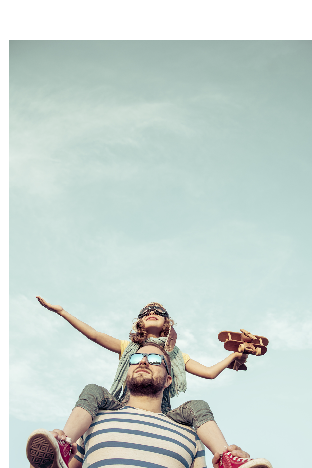 Kid with jet pack pretend to be superhero. Child playing with father in summer. Happy dad and son outdoors. Success, leader and winner concept